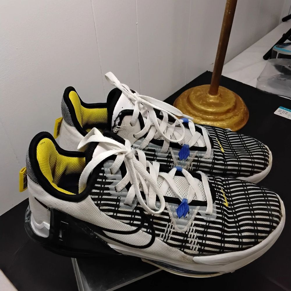 Nike White and Black Athletic Shoes with Yellow Accents